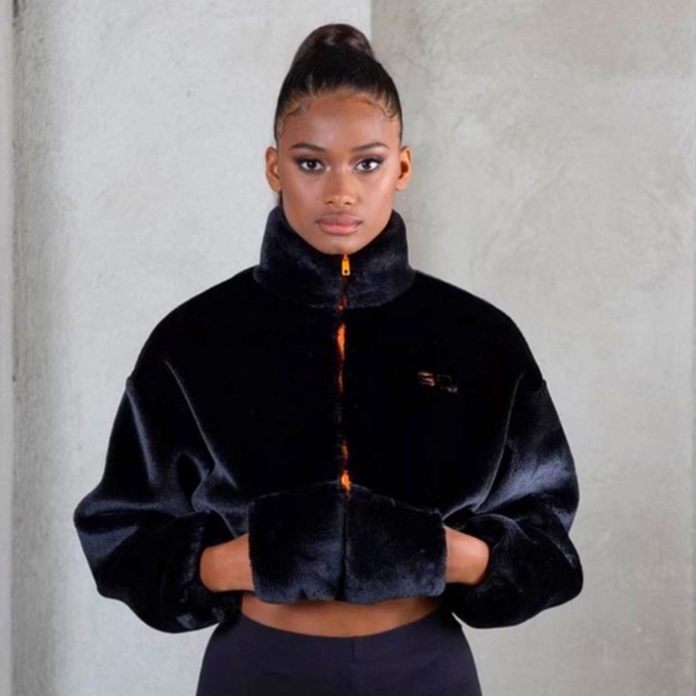 GOI size small cropped faux fur black jacket with orange zip up and logo